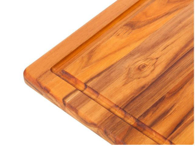 https://www.artisancraftedhome.com/images/thumbs/0066650_edge-grain-rectangular-carving-board-with-hand-grip-and-juice-canal-by-proteak.jpeg