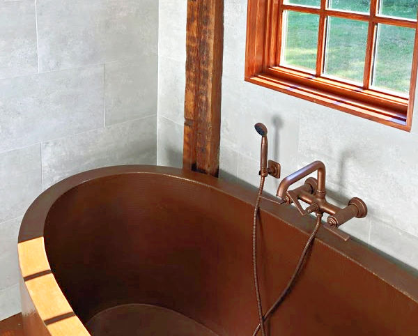 Oval copper Bath Tub installation by SoLuna